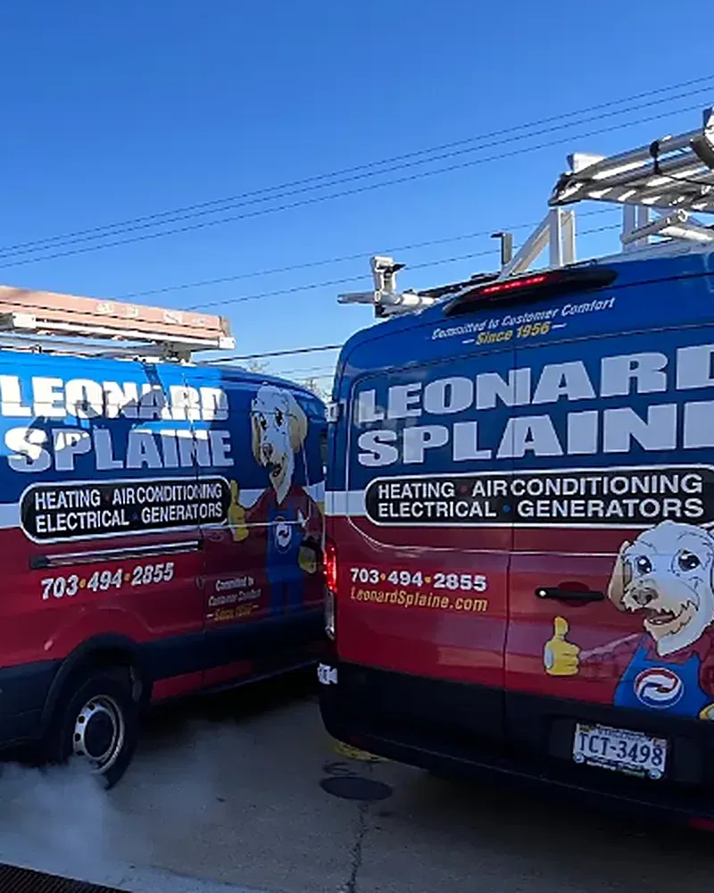 Leonard Splaine service vans lined up at the shop in Woodbridge