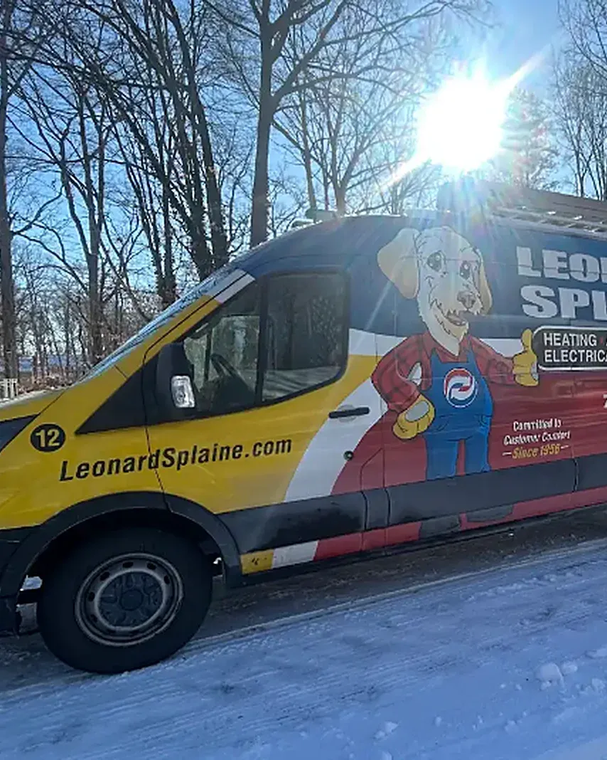 A Leonard Splaine service van on a snowy Northern Virginia street