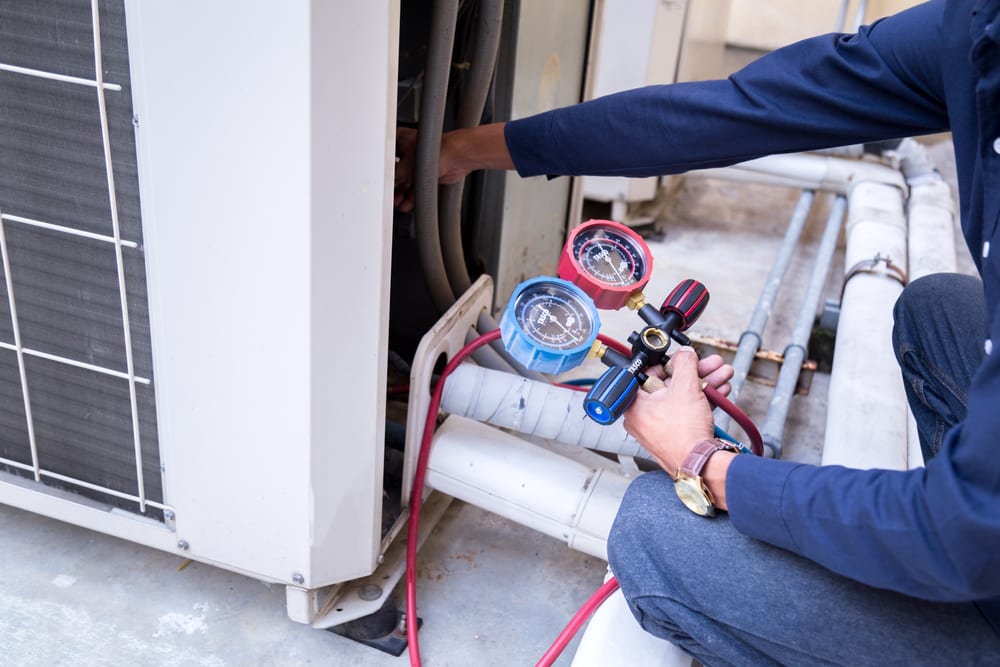 Technician working on Air Conditioning unit