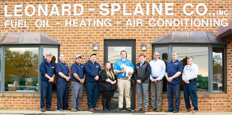 The Leonard Splaine Team with Sonny in front of the building