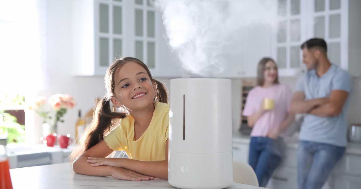 Family in kitchen with modern air humidifier